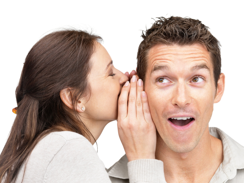 Young woman telling a secret to a man Portrait of young woman telling a secret to a man over a white background